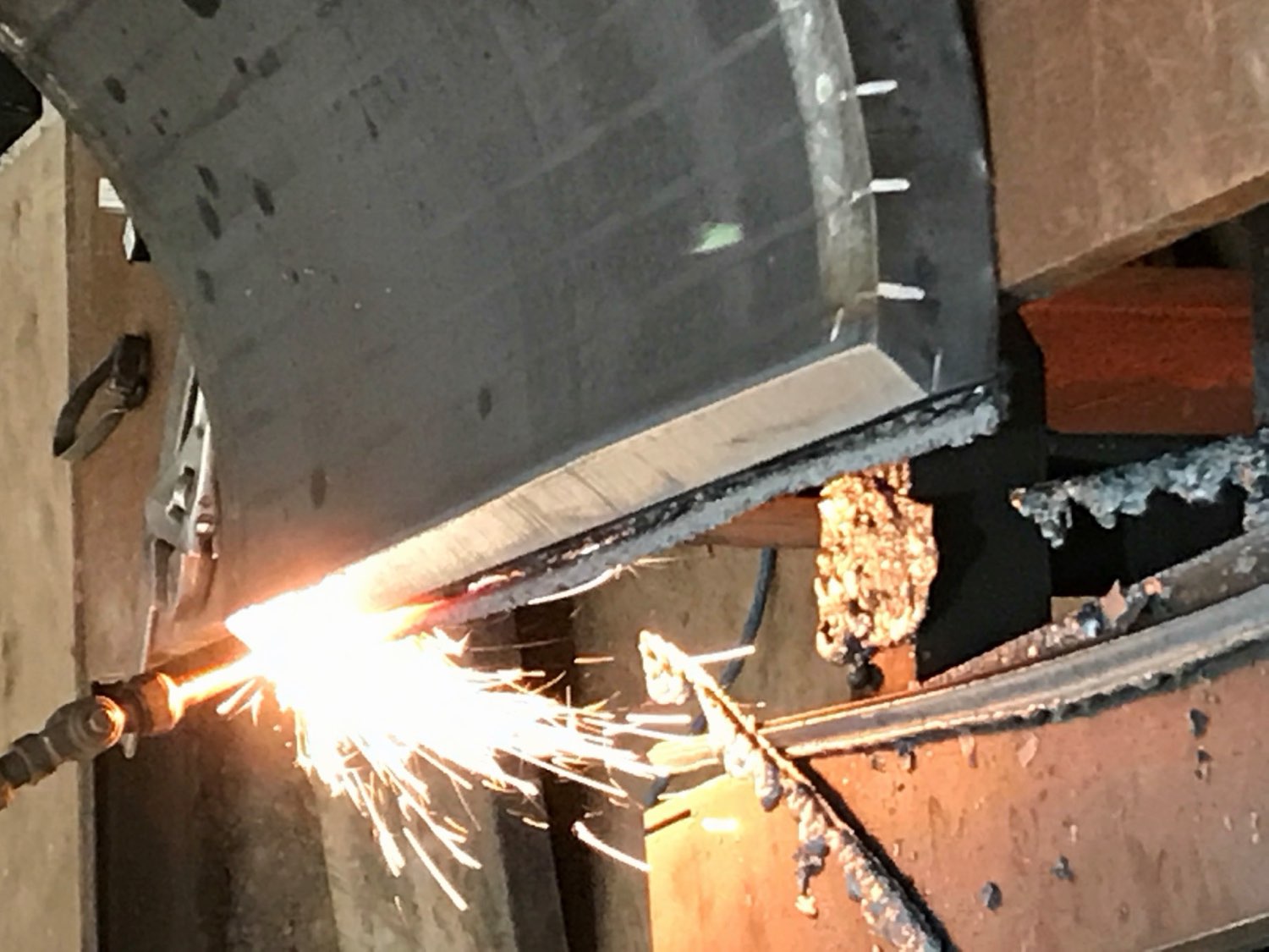 Oxy-fuel torch cutting thick steel plate